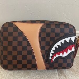 Limited edition spray ground bag with chic red interior